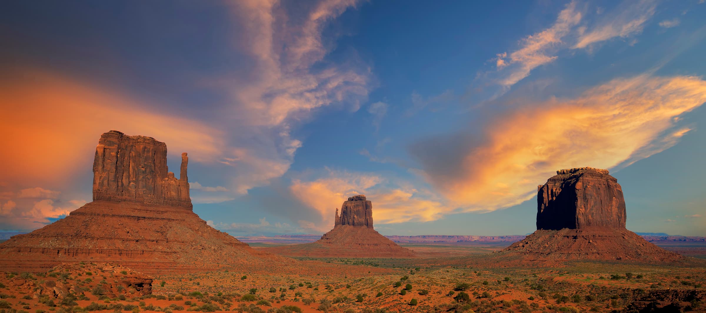 Desert buttes under a sunset sky